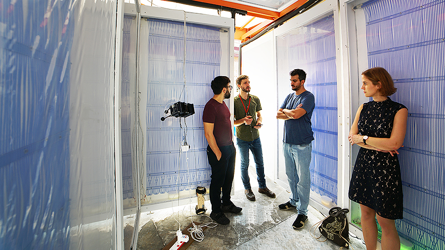 Eric Teitelbaum (center), speaks to visitors inside the Cold Tube pavilion in Singapore. (Photo courtesy of Lea Ruefenacht)