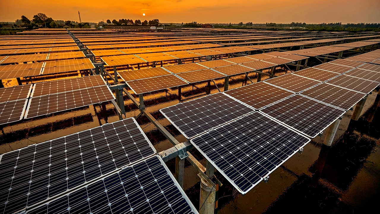 construction crane lifting pre-fabricated concrete panels into place for a new building