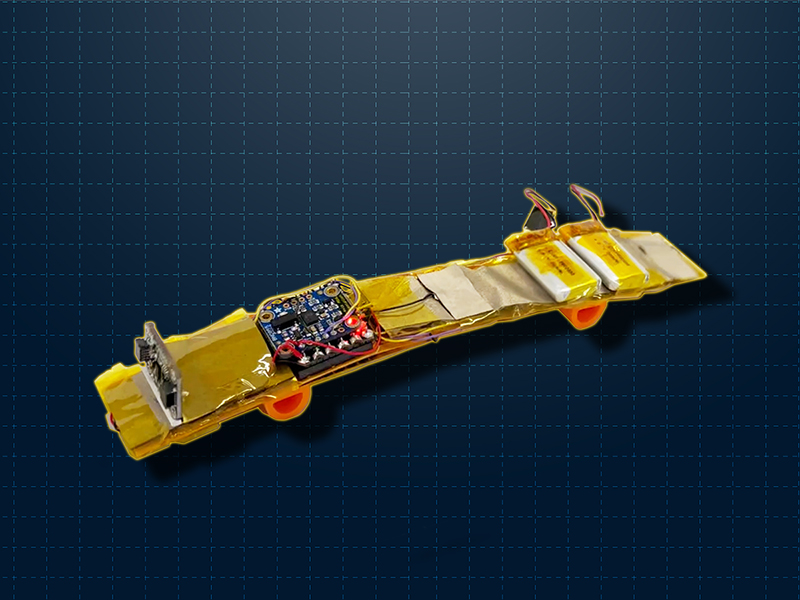 An yellow skateboard-like device overlayed over a blue graph paper background