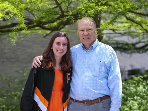 Female Princeton graduate poses alongside her male professor