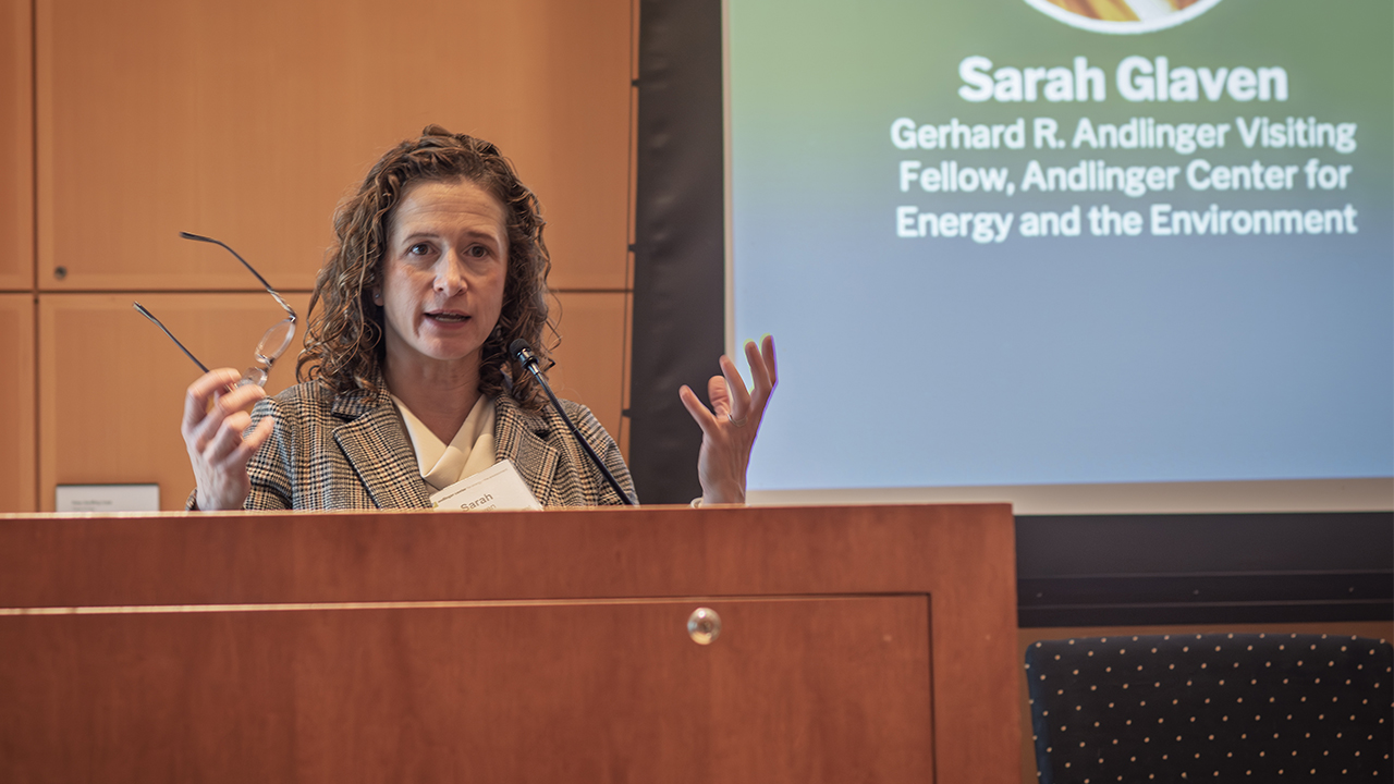 Sarah Glaven at a podium speaking