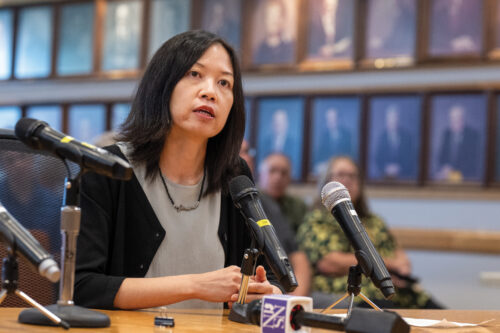 A woman in a congressional hearing speaks on a mic.