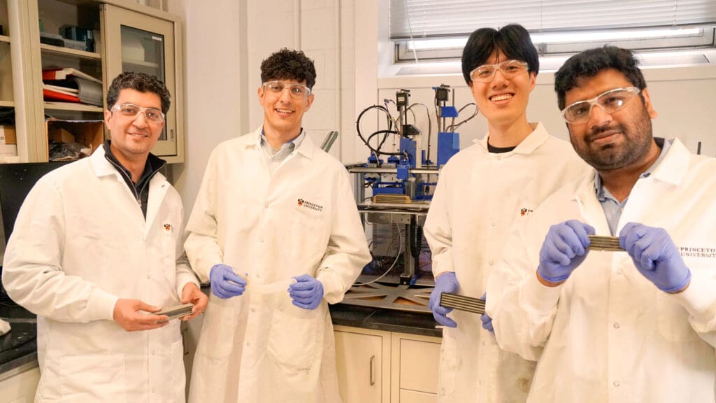 Four men in lab coats.