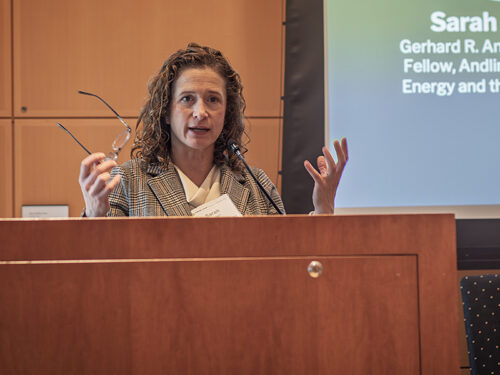 A woman speaks at a podium
