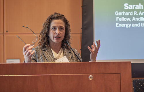 A woman speaks at a podium