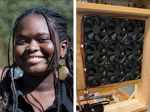 A smiling young woman with braided hair and large earrings beside a homemade wooden cooling unit fitted with a grid of fans.